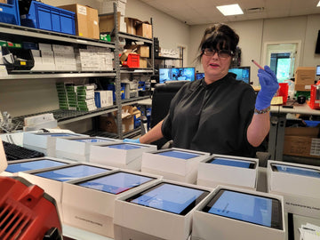 CSG team member managing mobile device deployment for business clients