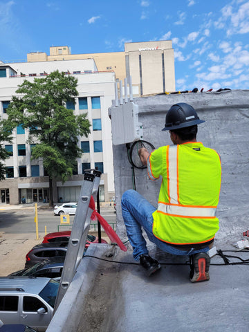 CSG technician performing professional business internet installation